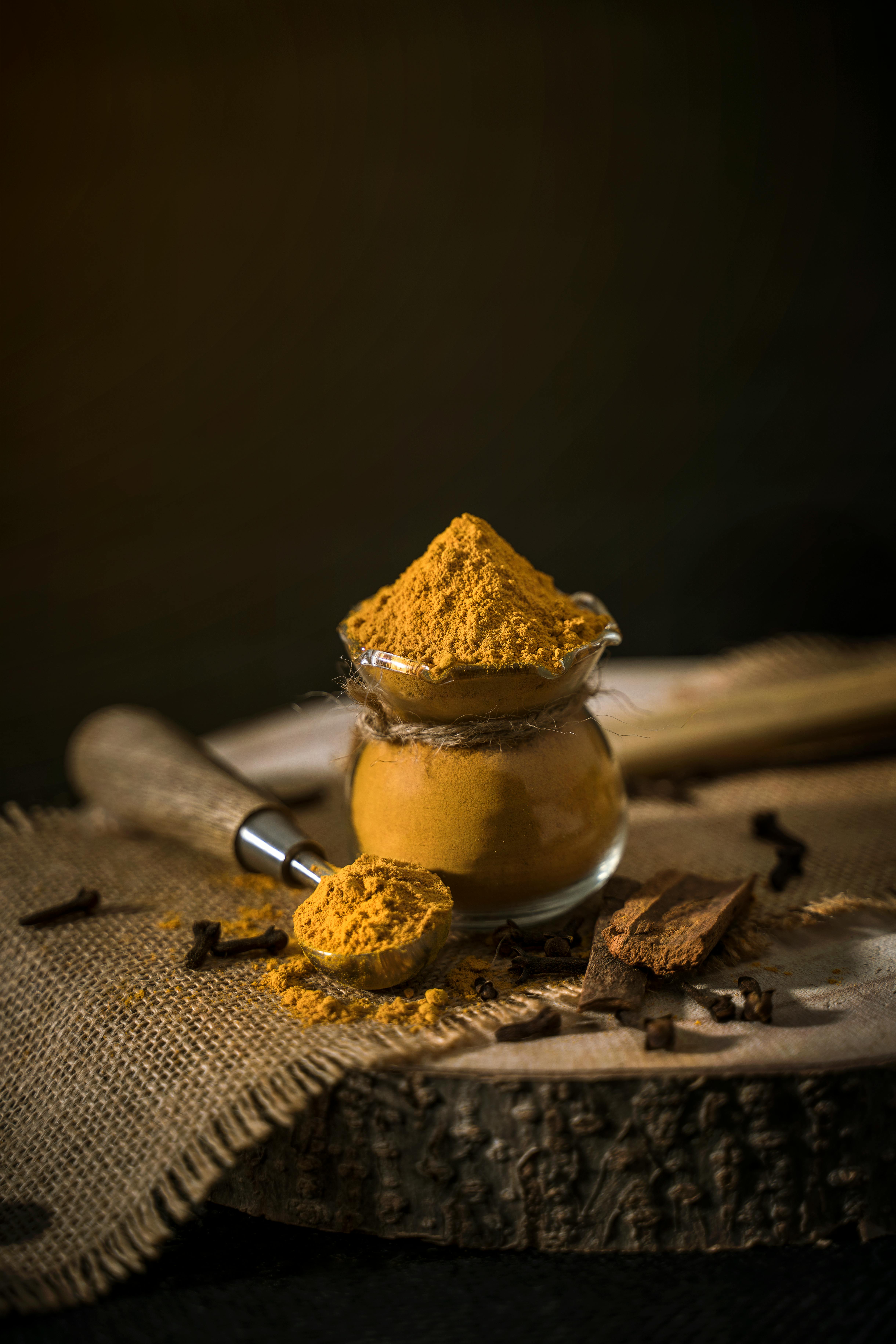 Turmeric powder in a small glass jar