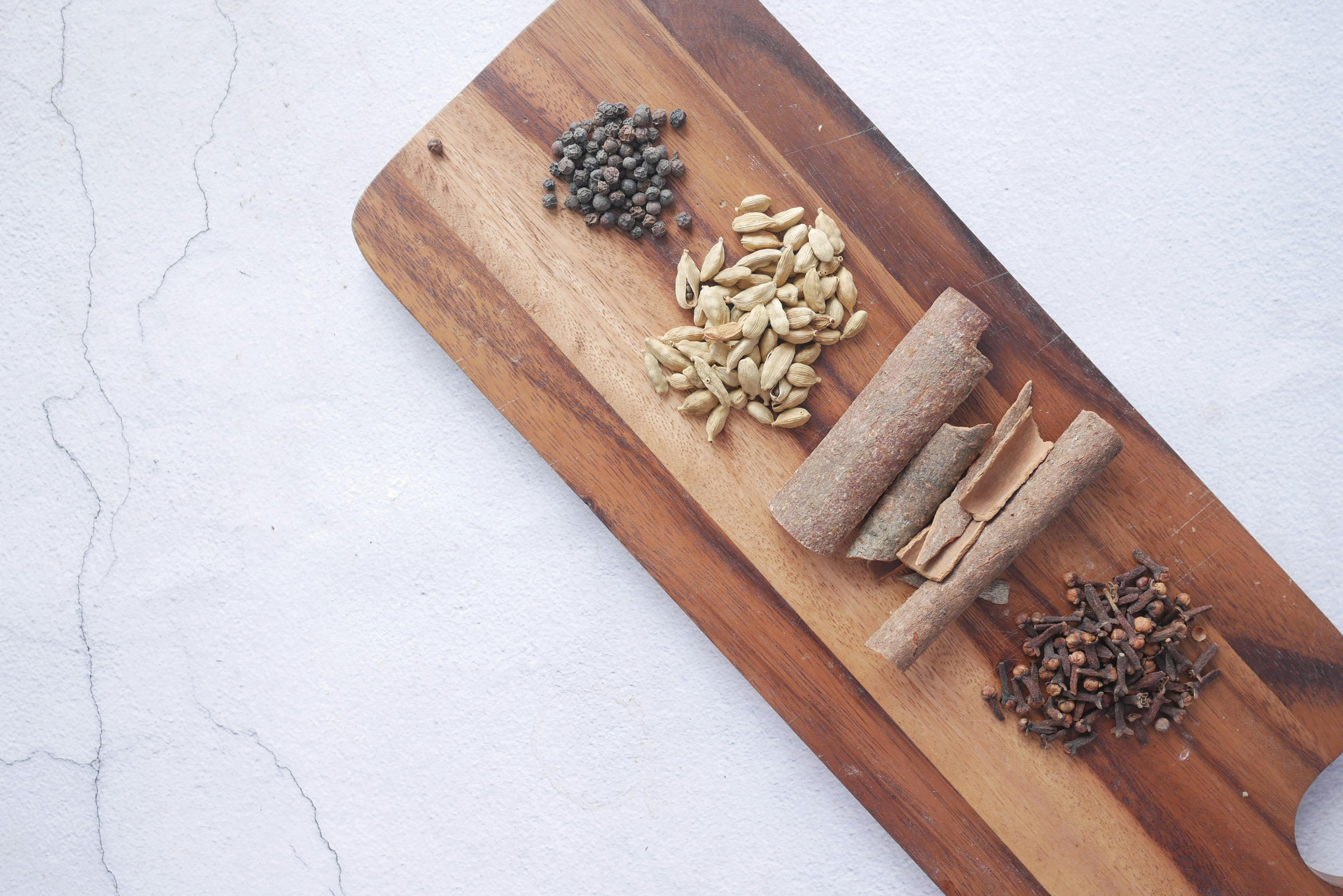 Whole Kerala spices on a wooden board